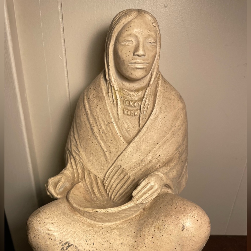 Native American woman holding a bowl statue. Austin Productions. 1983.